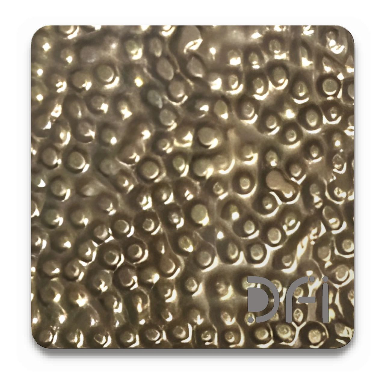 Dimpled brass, Embossed finish: a DFI sample plate with the DFI mark laser-cut in the corner
